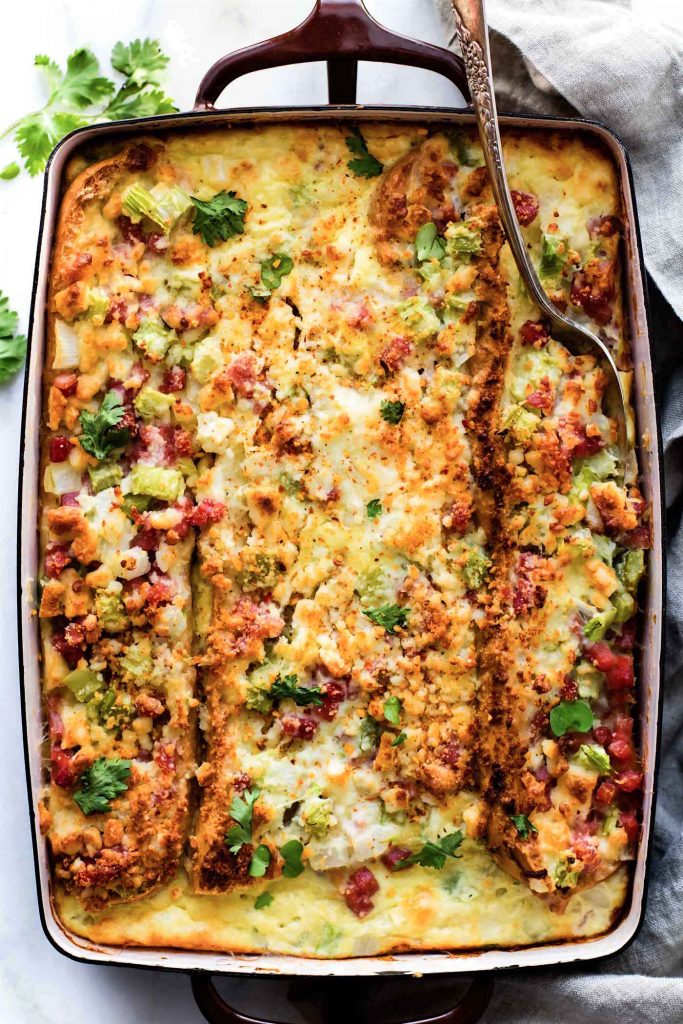 A Gluten Free French Bread Ham Breakfast Strata recipe that's easy-to-follow and will please everyone! Yes, it does exist! A Breakfast Casserole you can make ahead or bake in 30 minutes. Layers of breakfast staples like eggs, French bread, ham, veggies, and more. Great for a gluten free Brunch or Holiday table!