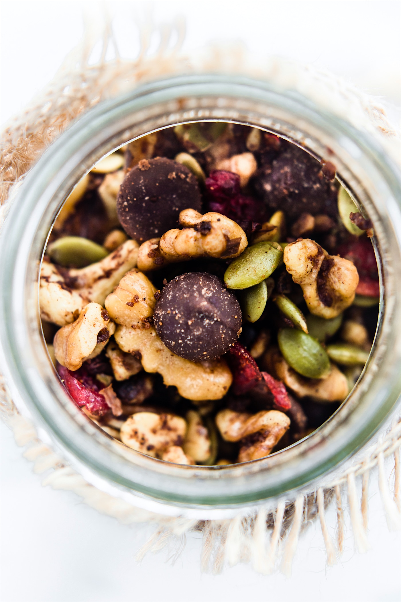 overhead image of healthy fall trail mix in a mason jar