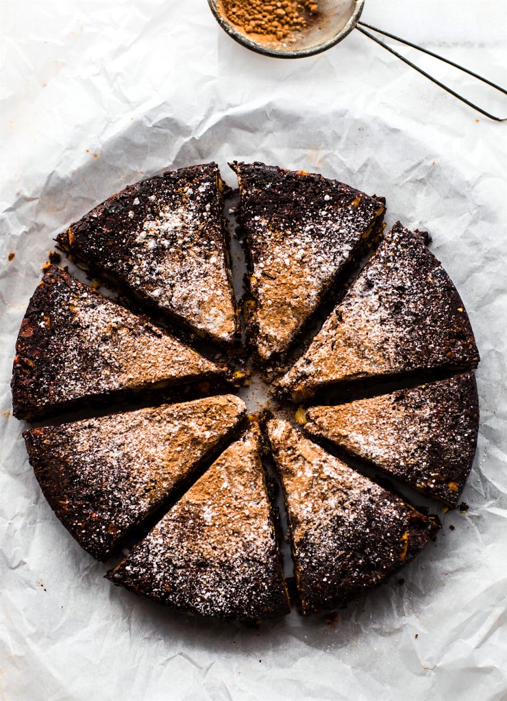 Panforte Italian Christmas Cake, sliced into triangles dusted with powdered sugar