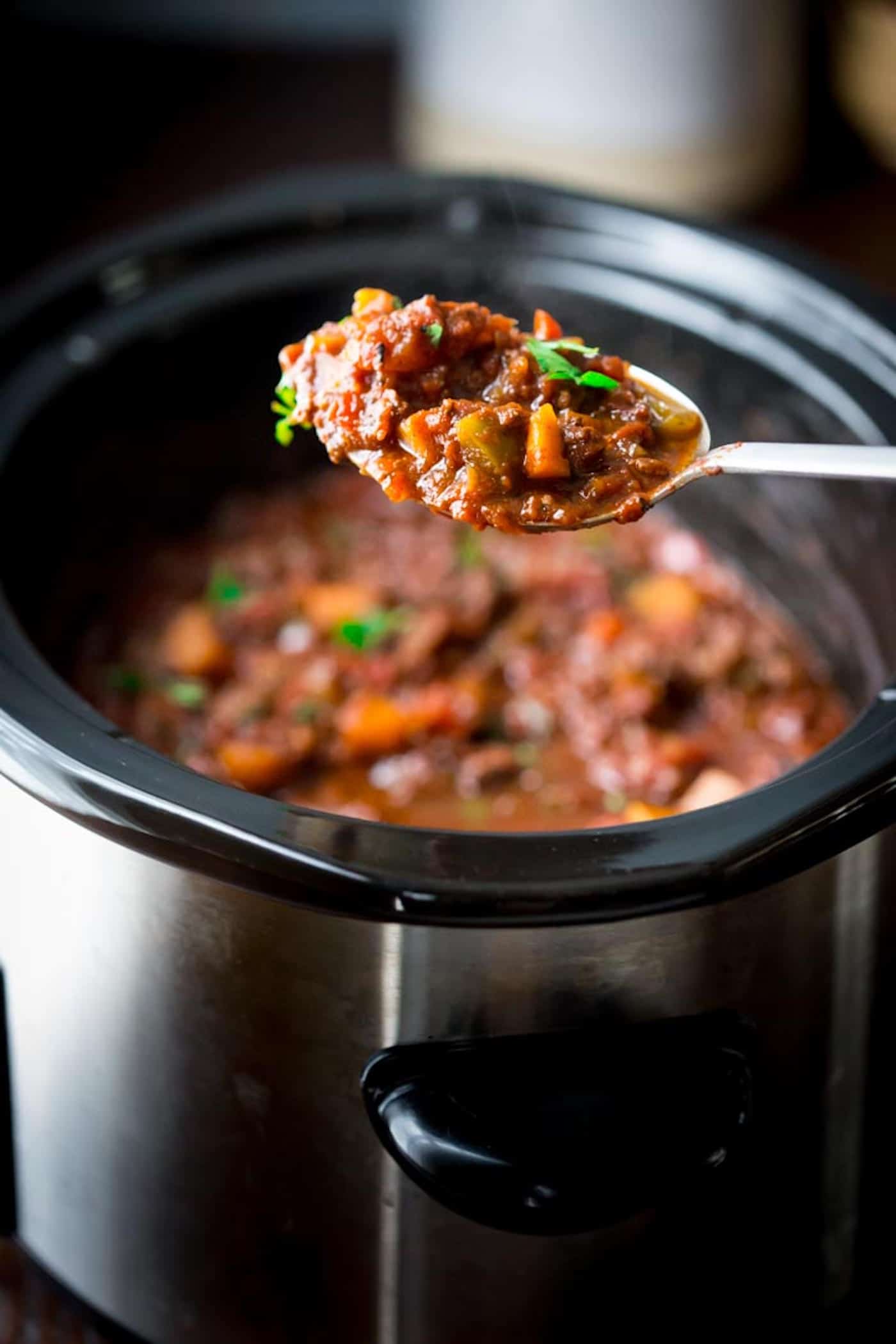 Paleo beef chili is not only easy to make in a slow cooker, but also full of flavor! Loaded with sweet potatoes, beef, spices, tomatoes, and more. It's whole 30 friendly, quick to prep, and pure comfort food. | CotterCrunch.com