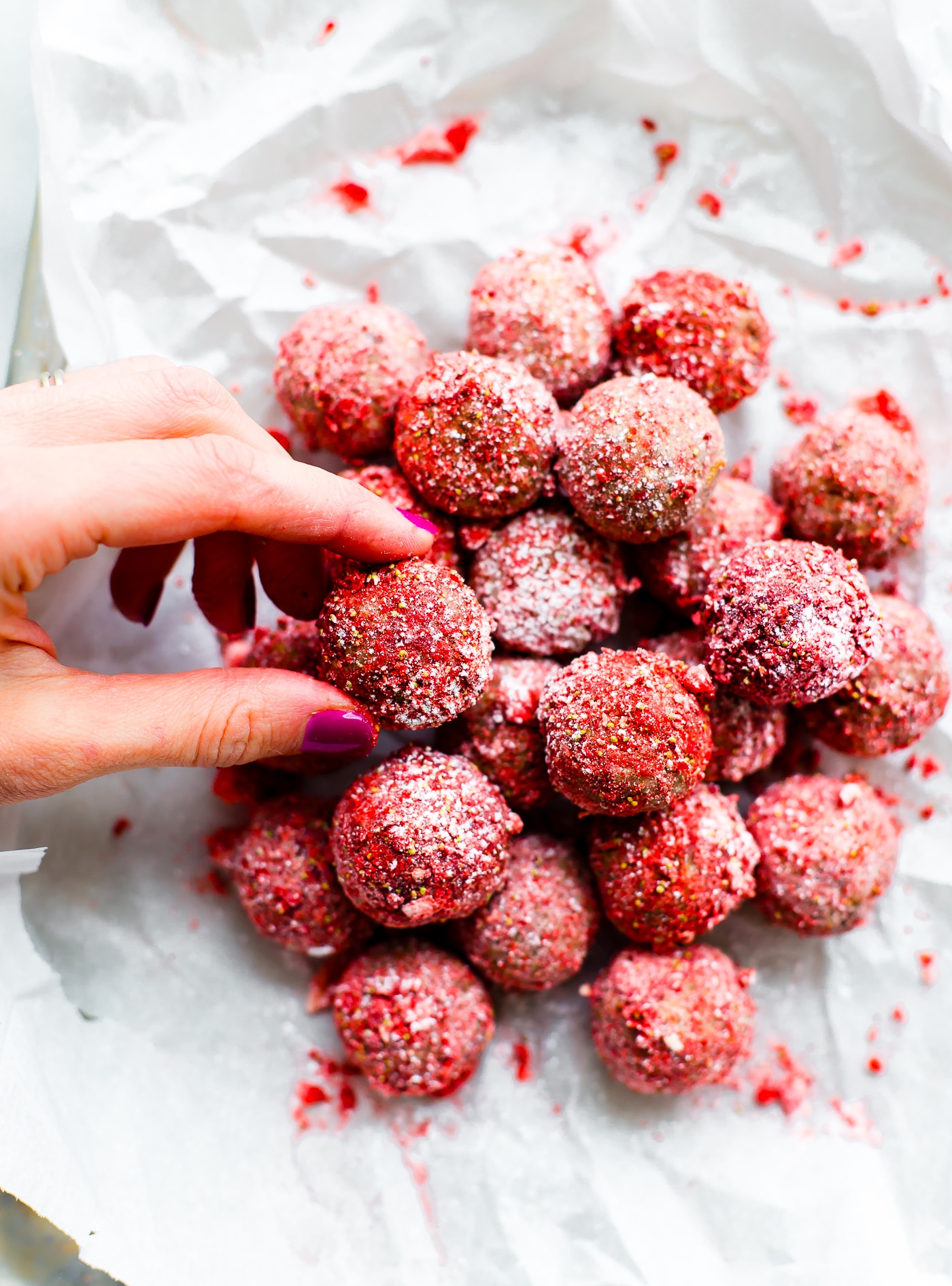 These Vegan No Bake Strawberry Cake Bliss Bites are the bite size healthy dessert. Just dried Strawberries, cashew cream, gluten free granola/flour, and a sweet jam filling! Tart and tasty! A vegan cake bite that requires no baking, just blissfully nourishing. Paleo friendly.