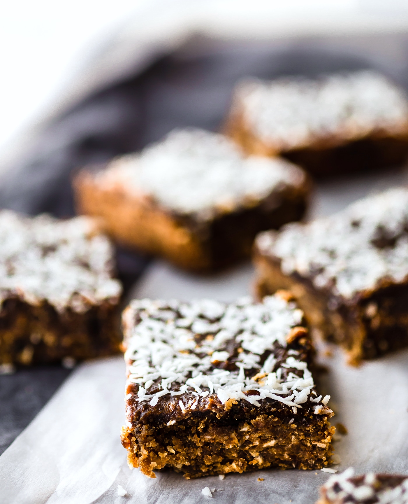 These Paleo Almond Butter Jelly Energy Bars are one of our favorite bars that fuel us for workouts and snacking on the go. Made with few ingredients; no oils and no refined sugar. Blended and Baked in just 30 minutes, Which makes them pretty amazing! So chewy and flavorful that you'd never know they were healthy. Freezer friendly.