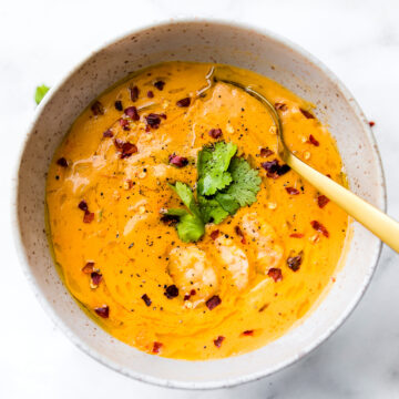 This creamy roasted red pepper bisque with Shrimp is dairy free, paleo, and totally delicious! A spicy bisque with healing immunity boosting nutrients. Perfect for cold weather or under the weather! Also a great way to get veggies into your meal. Nourish your family, feed your friends, or enjoy this robust roasted red pepper bisque recipe all to yourself. Whole 30 compliant! | CotterCrunch.com