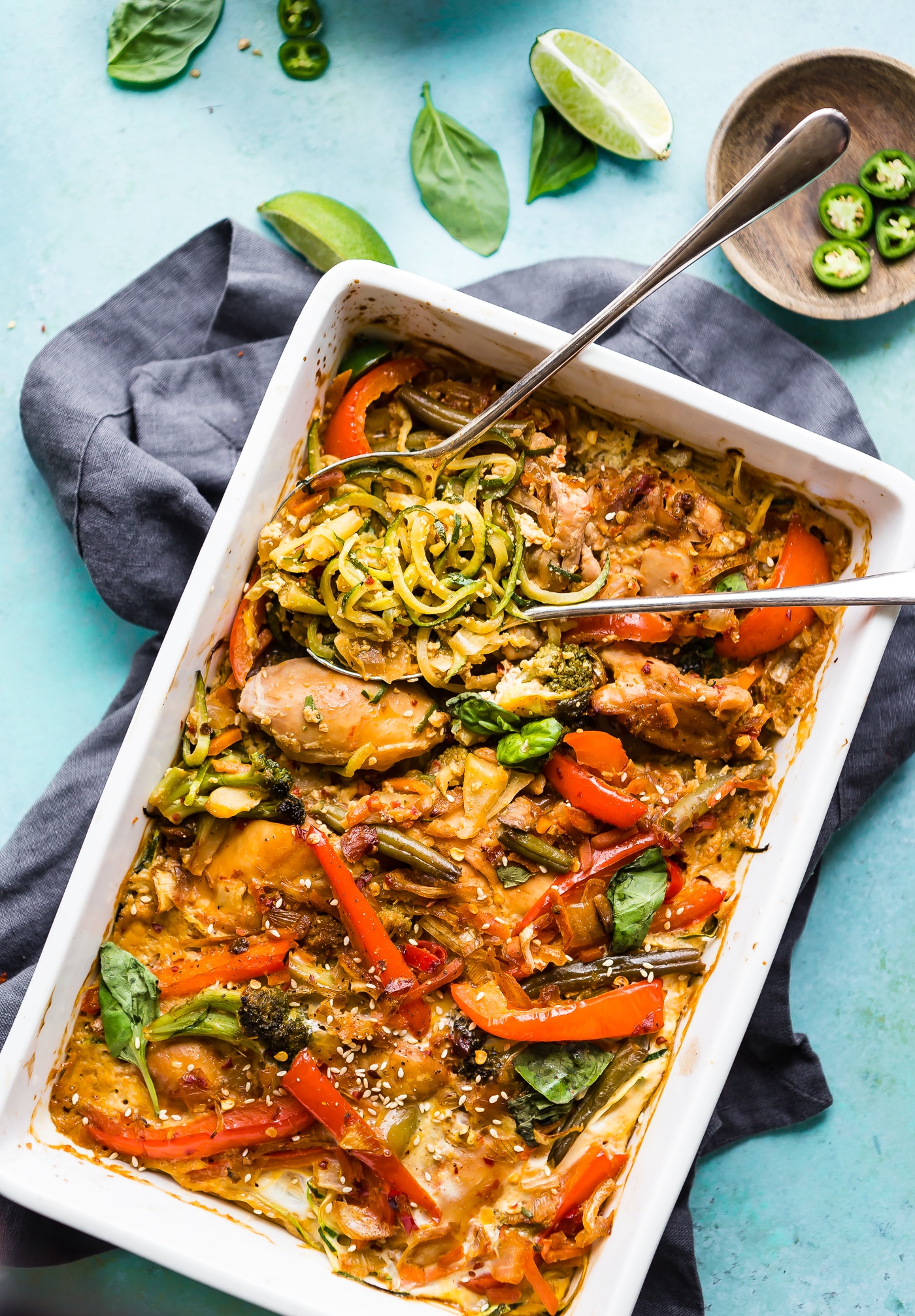 Drunken Chicken Zoodle Casserole takes a spin on the original Pad kee mao Asian stir fry and puts it in casserole form. A paleo zucchini noodle casserole with tons of flavor, Thai spices, and simple healthy ingredients! A delicious, light, high protein, low carb recipe.