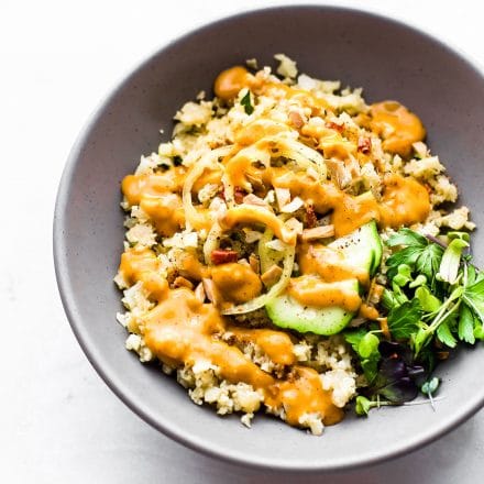 Chili Garlic Cauliflower Risotto Bowls are an easy Paleo dish to satisfy that comfort food craving! A healthy vegan recipe with a spicy sauce. #paleo #vegan #cauliflower #dinner #healthy #dairyfree #risotto