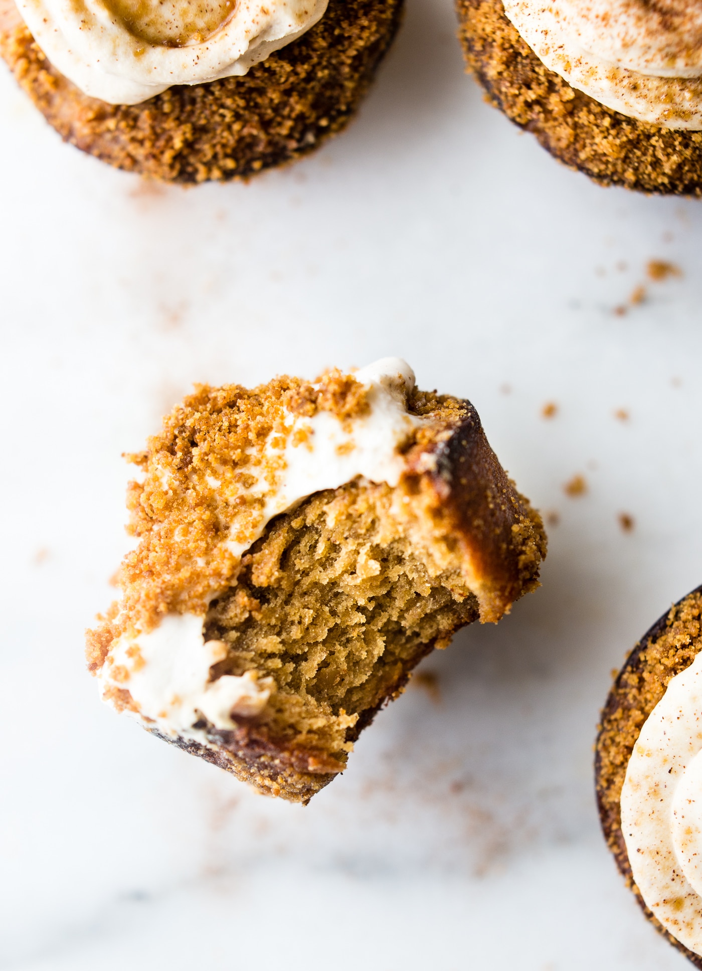 Flourless Peanut Butter Churro Cupcakes with Coconut Frosting! A gluten free cupcakes recipe that's easy to make, sweet, buttery, flakey, & paleo friendly.