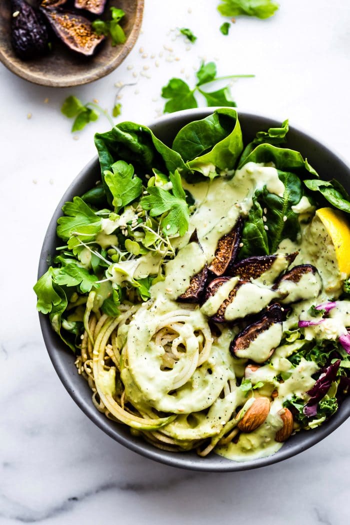 A fig nourish bowl topped with vegan green goddess dressing.