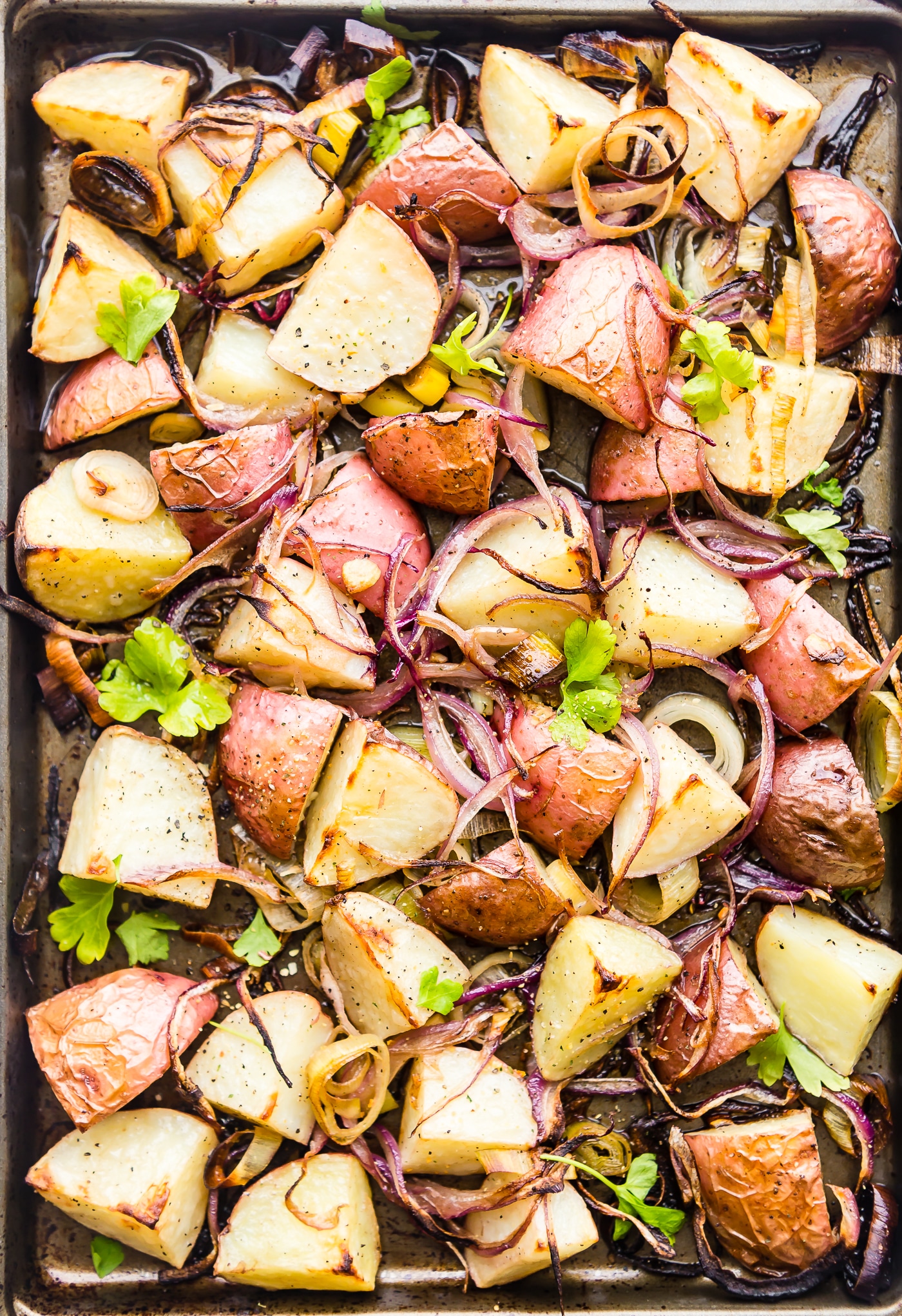 Leek and Oven Roasted Potato! This Vegetable Pan Roast is packed with Seasonal Leek, Potato, and Steamed Spinach Greens! A flavorful, healthy, and easy to make side dish you can make all in one pan! A paleo/vegan Spring recipe perfect for any gathering. Whole 30 friendly!