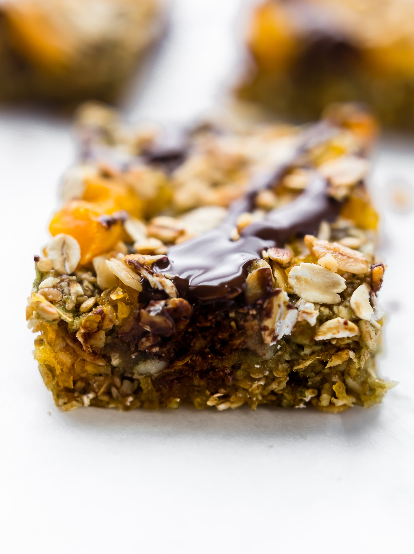 No Bake Apricot Oat Protein Bars easy to make, wholesome, and nut free! Made with dried apricots, gluten free oats, protein, & seeds! Sweet, chewy, vegan!