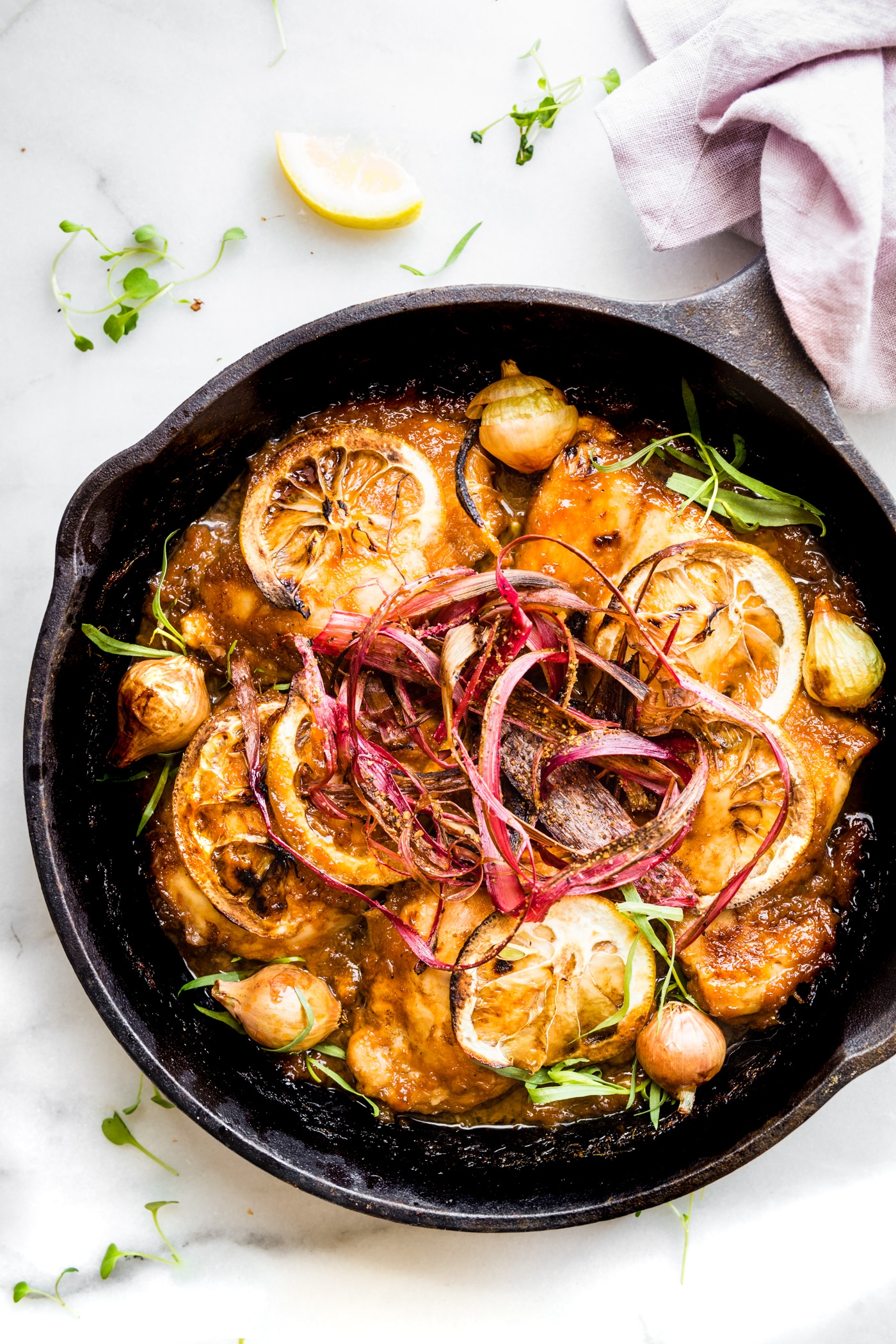 Crispy Rhubarb Baked Chicken in a cast iron skillet