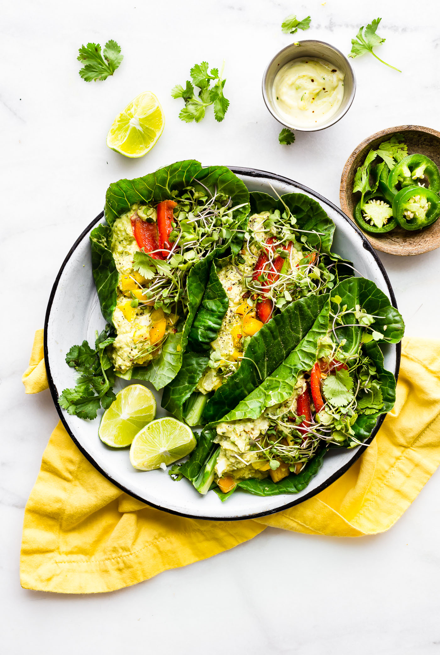 These Mexican avocado egg salad wraps make for a perfect low carb veggie packed lunch! Paleo Avocado Egg Salad seasoned with Mexican spices and jalapeño, then all wrapped up in collard greens! Whole 30 friendly.