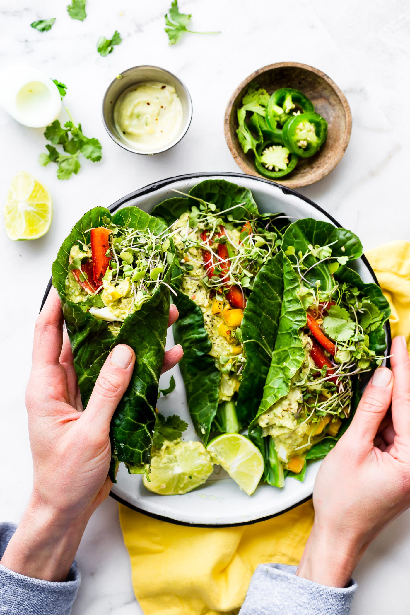 These Mexican avocado egg salad wraps make for a perfect low carb veggie packed lunch! Paleo Avocado Egg Salad seasoned with Mexican spices and jalapeño, then all wrapped up in collard greens! Whole 30 friendly.