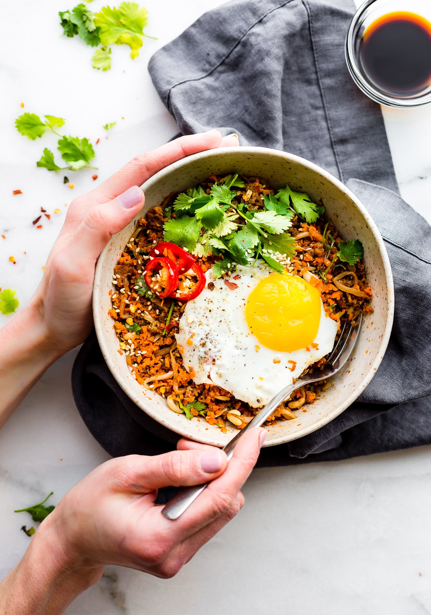 This Quick Carrot Rice Breakfast Nasi Goreng is the perfect way to utilize those leftover veggies! A stir fried "carrot rice" mixed with egg and sausage. A Indonesian style breakfast Nasi Goreng that's paleo friendly, super flavorful, and packed full of protein and veggies! Cook and serve all in 30 minutes!