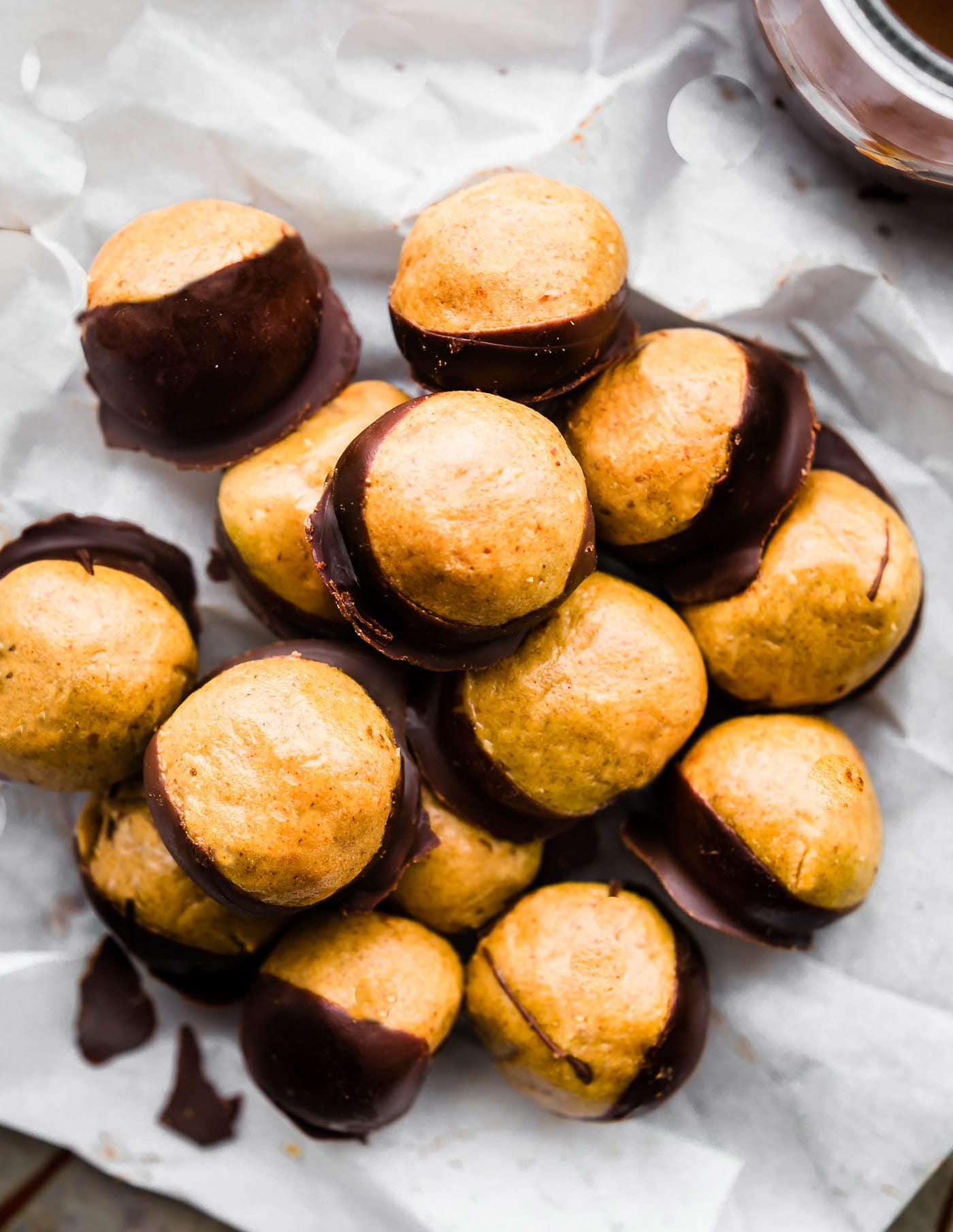 A Buckeyes Recipe Packed with Protein! These Vegan Peanut Butter Protein Buckeyes are super easy to make and coated in dairy free dark chocolate. Gluten free with a Paleo option. A classic Buckeyes Recipe with a healthy boost! No baking required so make as many as you can, mmm k?