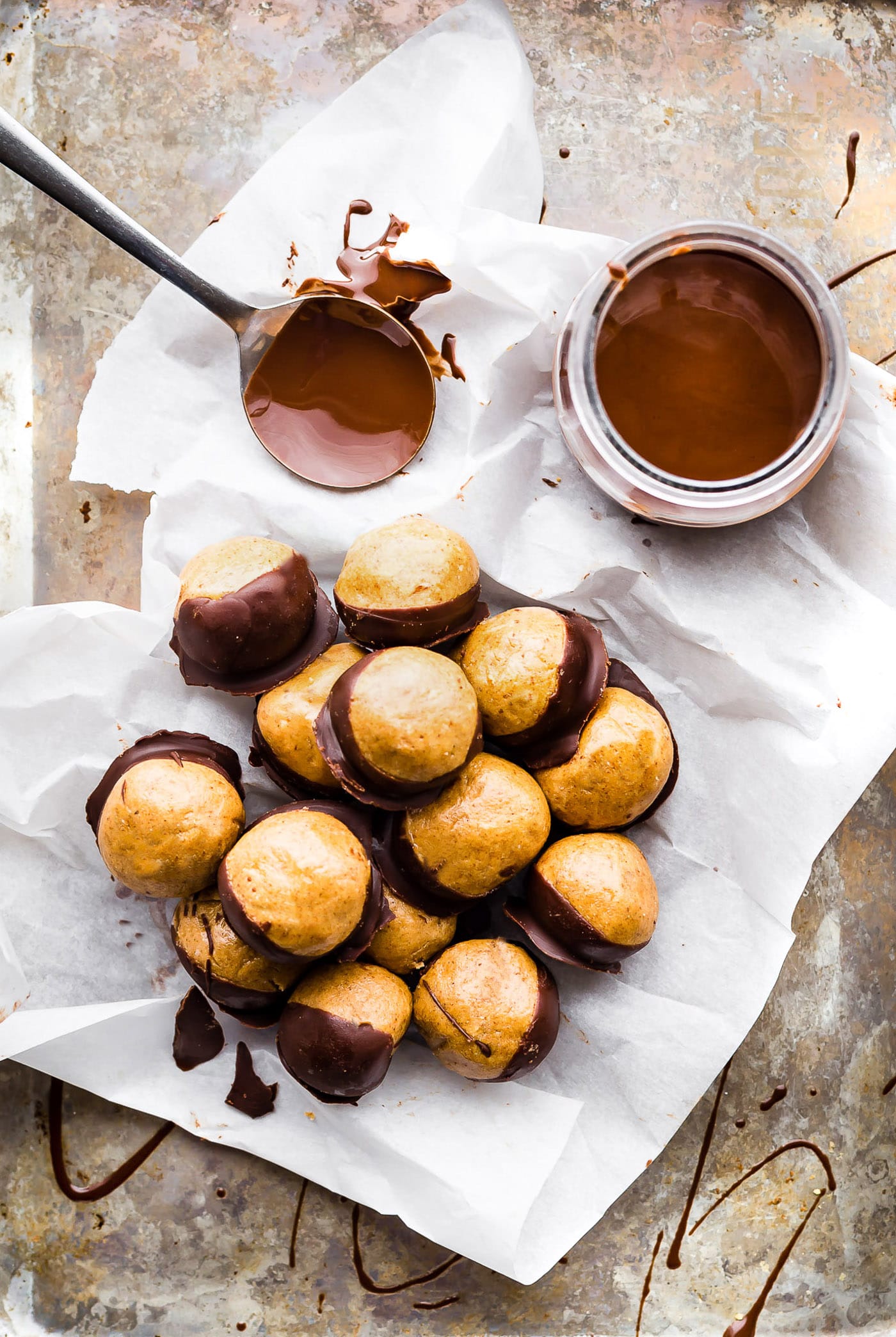 A Buckeyes Recipe Packed with Protein! These Vegan Peanut Butter Protein Buckeyes are super easy to make and coated in dairy free dark chocolate. Gluten free with a Paleo option. A classic Buckeyes Recipe with a healthy boost! No baking required so make as many as you can.