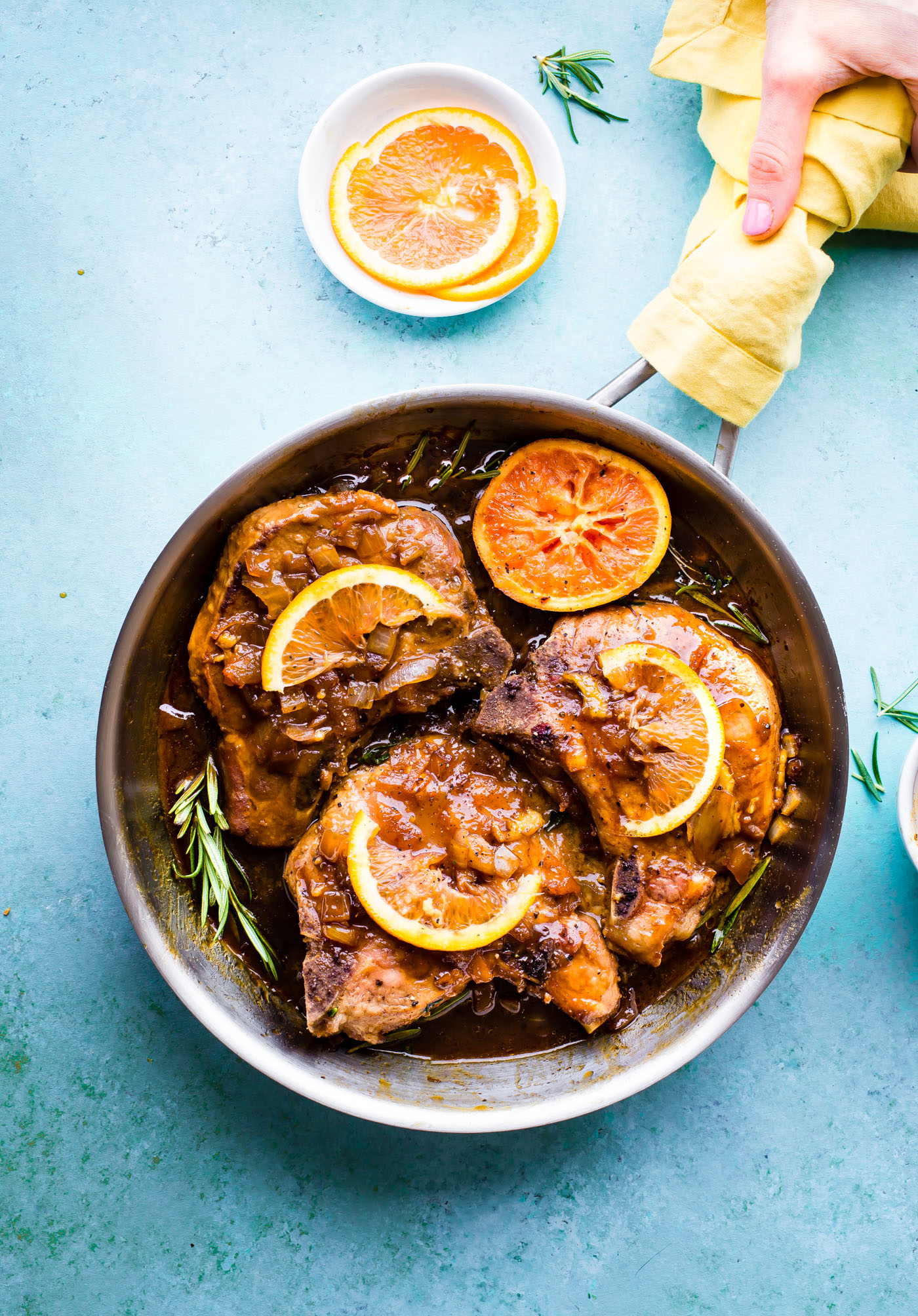 A Sticky Skillet Marmalade Marinated Pork Chops recipe that's quick to make with just a few simple ingredients! A Healthy one pan meal made with fresh orange, molasses, onion, marmalade, and seasoning. Just mix and marinate the pork chops for a sweet and tangy flavor. Naturally gluten free, dairy free, and paleo friendly.