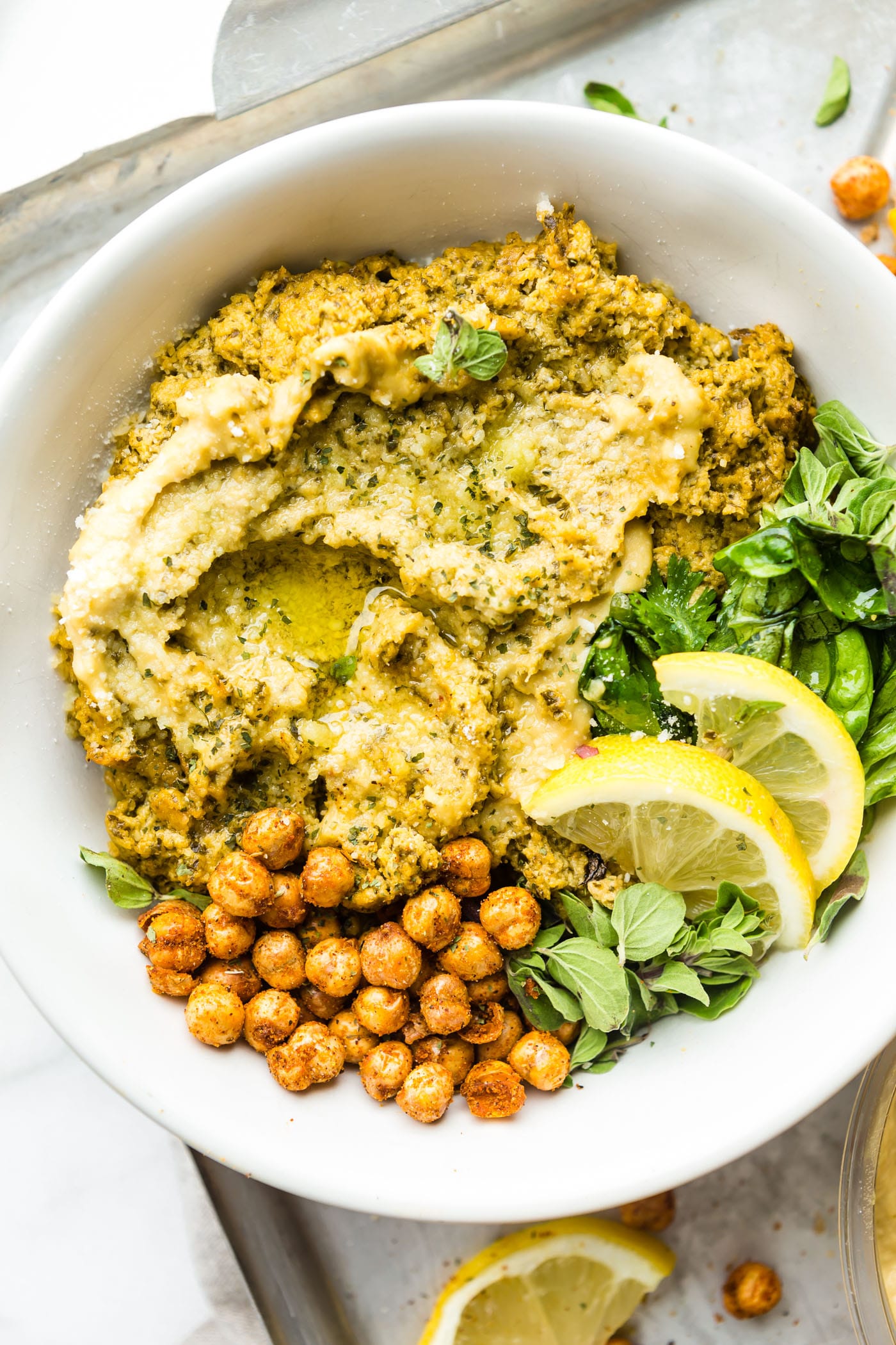 This Warm Mediterranean Spinach Artichoke Hummus Dip is a meal in itself. A vegetarian Mediterranean Baked Hummus Dip that's wholesome and healthy. Simple real food ingredients that you blend and bake! Gluten free, plant based, and delicious.