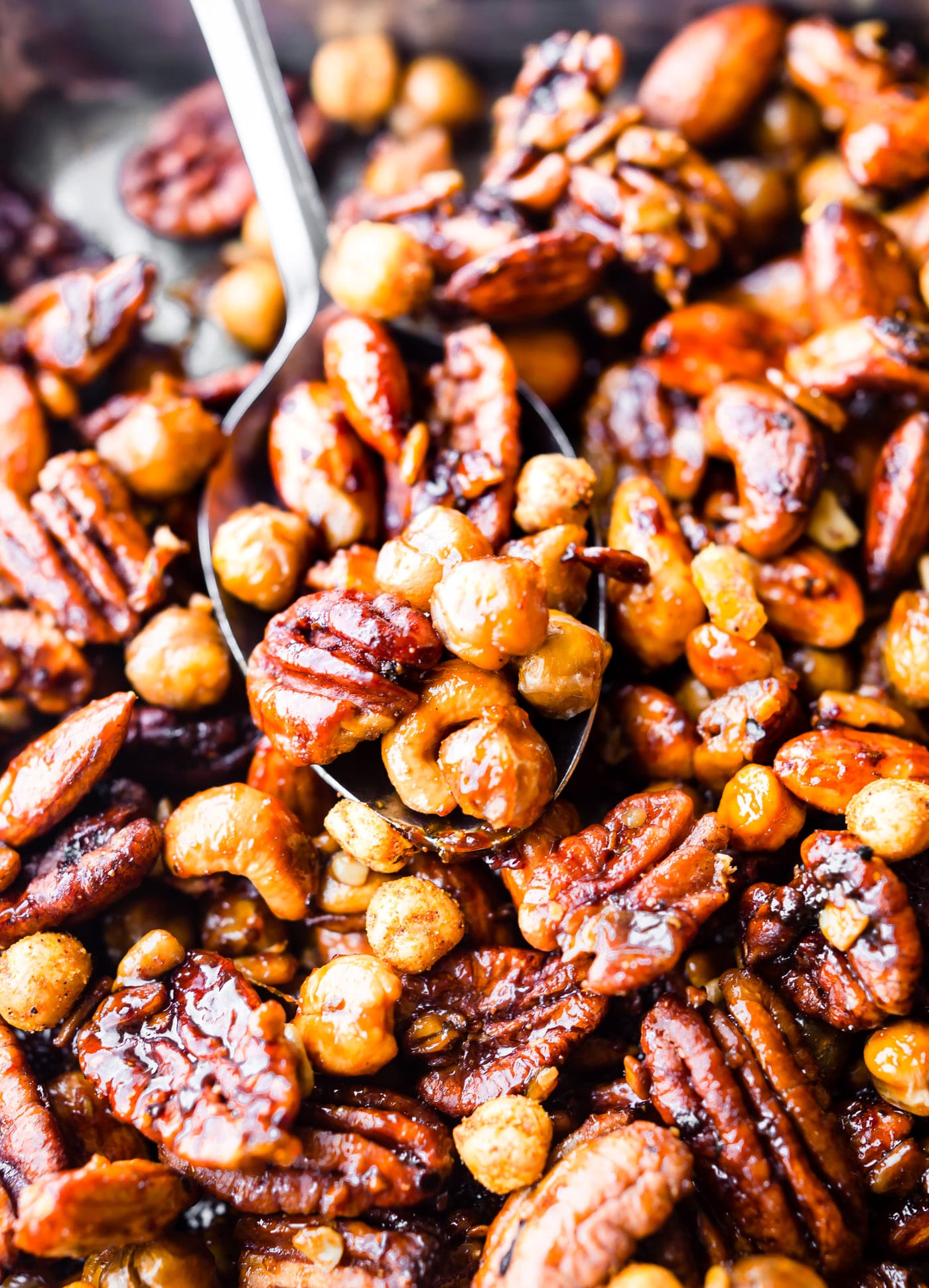 Spicy candied cajun trail mix made easy in the instant pot! What's not to love? This candied cajun trail mix is the perfect quick and healthy snack and total crowd pleaser. Cajun Spices, maple syrup, nuts, seeds, and chickpeas all cooked together then mixed with dried mango for a sweet touch. It's vegan friendly and naturally grain free!