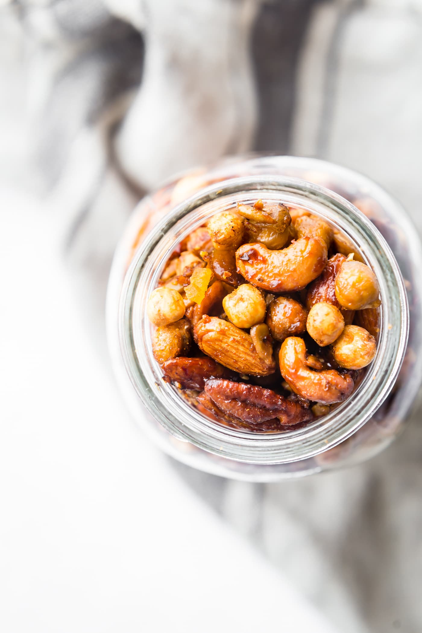 Spicy candied cajun trail mix made easy in the instant pot! What's not to love? This candied cajun trail mix is the perfect quick and healthy snack and total crowd pleaser. Cajun Spices, maple syrup, nuts, seeds, and chickpeas all cooked together then mixed with dried mango for a sweet touch. It's vegan friendly and naturally grain free!
