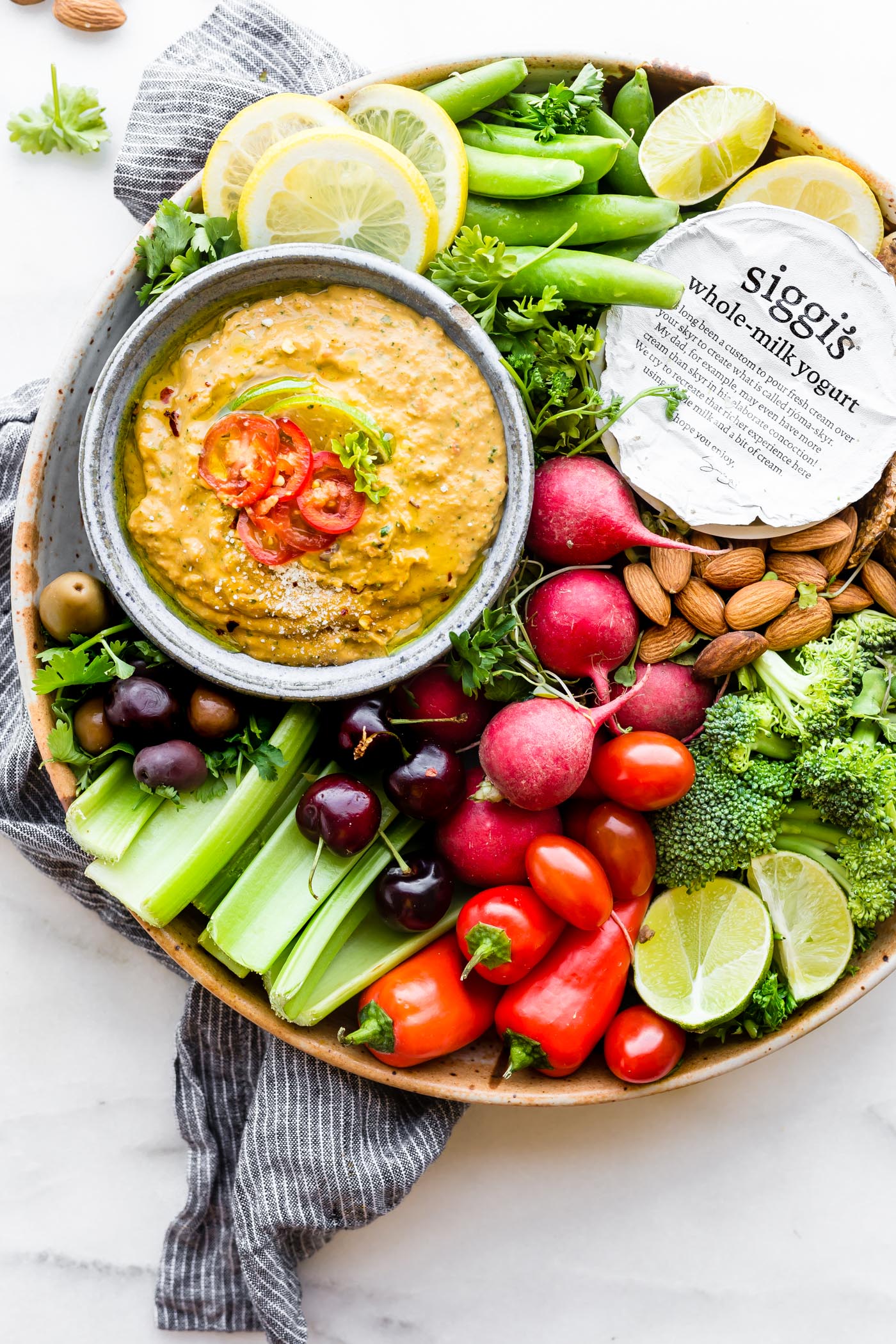 Spicy Mango Avocado yogurt dip! A NEW way to eat veggies! This Spicy mango avocado yogurt dipping sauce is NOT your average healthy appetizer! Mango, yogurt, avocado, and a kick of spice from chilis makes this easy snack recipe a protein rich dip! @siggisdairy! #ad