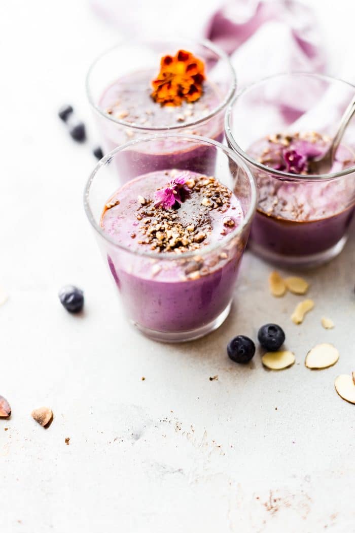 Almond Berry Cheesecake Smoothies in three cups.