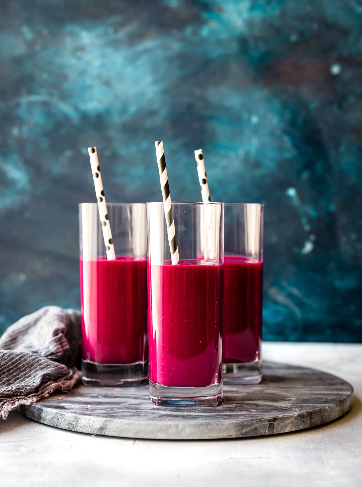 These Super Red SuperFood Smoothies are packed with a nutrient dense ingredients to boost energy, stamina, and vitality! Superfood Smoothies with hidden veggies, silky smooth almond coconut milk, and tropical fruits. Healthy, wholesome, paleo, and vegan friendly!