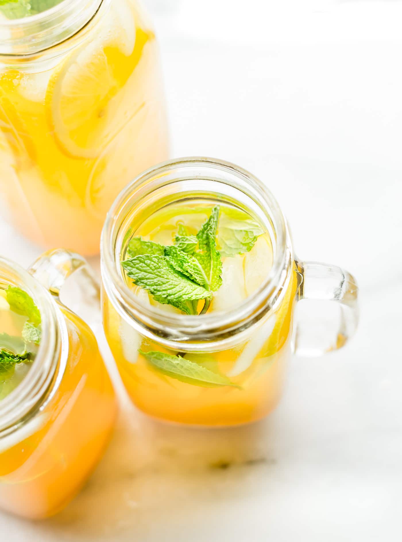 This Turmeric Ginger Lemonade with fresh Mint is great for fighting fatigue and reducing inflammation in the body. It's quick to make, naturally sweetened, and super refreshing! A homemade lemonade with a hint of spice, tartness, and Zing! Vegan, paleo, and AMAZING!