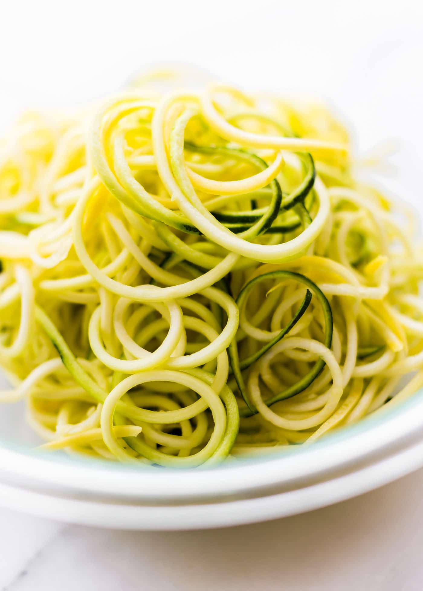 zucchini noodles cut into thin spirals in bowl