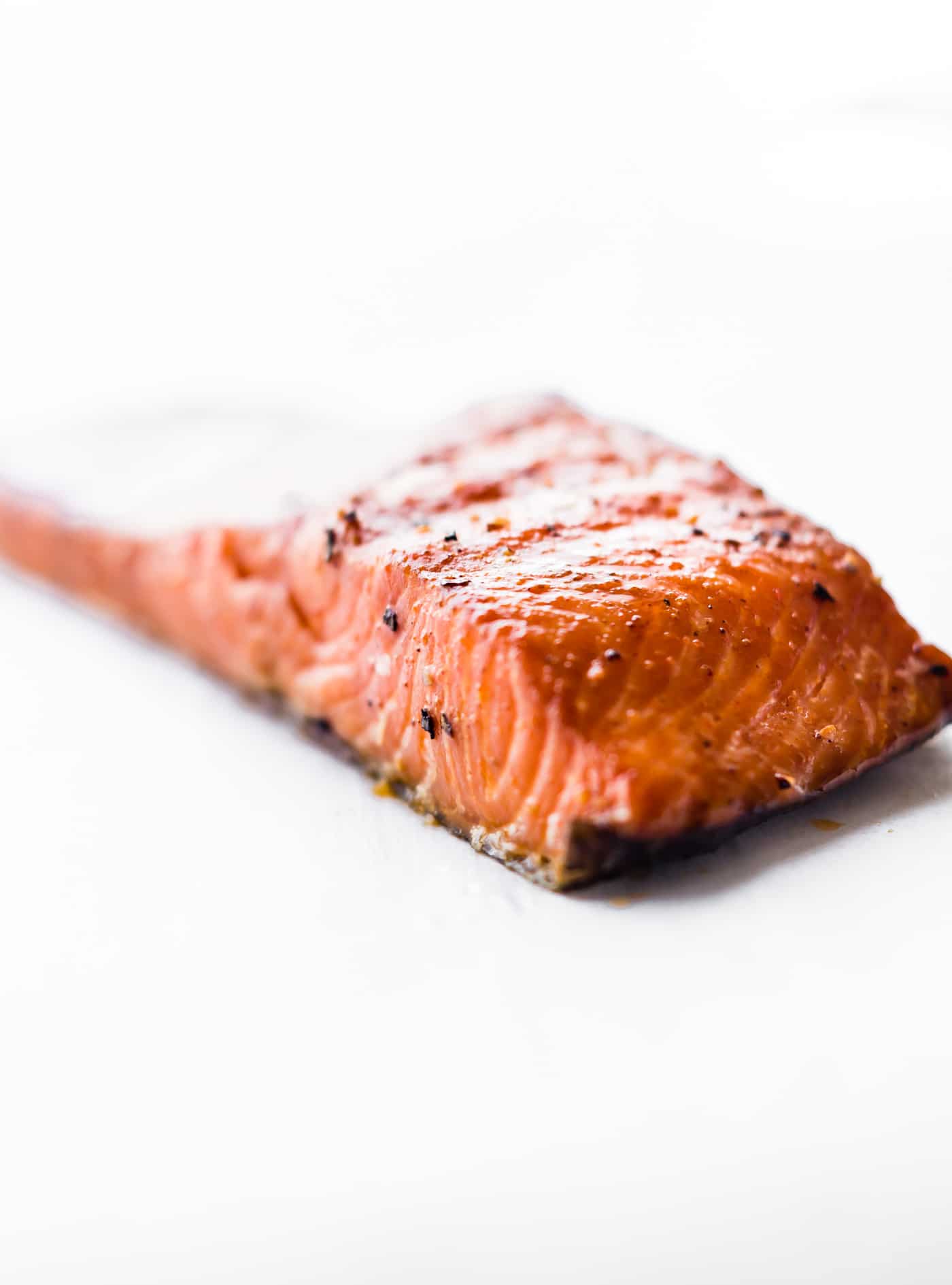 A piece of smoked salmon with a white background