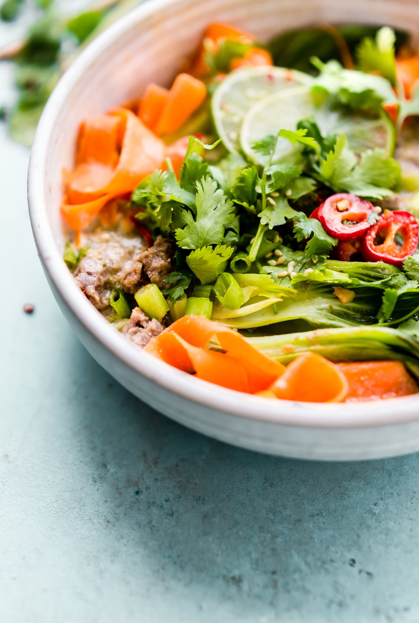 Thai green curry beef and veggies bowl recipe is for both the meat eater and vegetarian palate! A one pot green curry beef recipe that's quick to make and flavorful! No noodles needed, just lots of veggies and a creamy Thai broth! Paleo, Whole 30 friendly