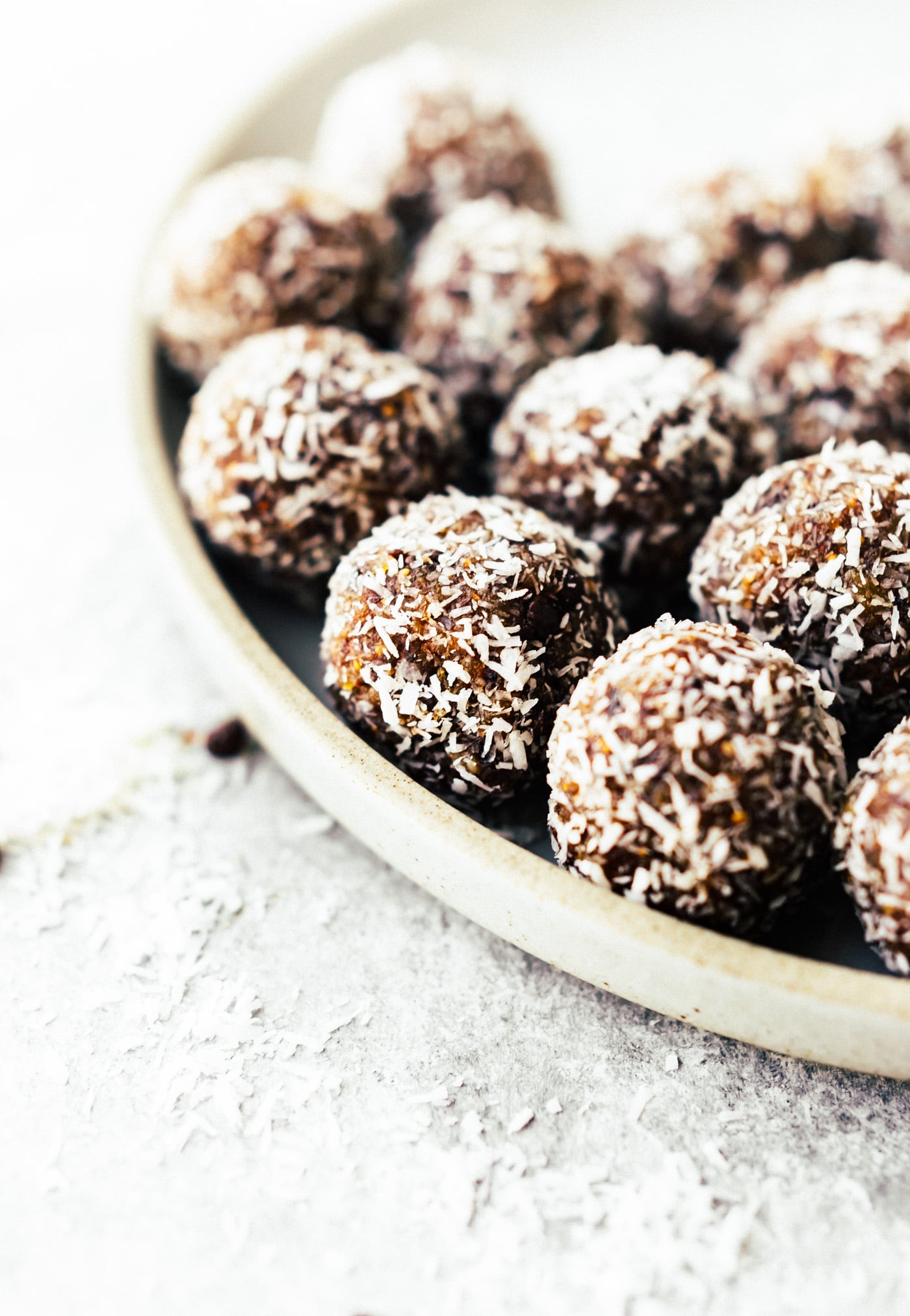 These No Bake Coconut Apricot Fig Bliss Bites are the perfect superfood energy bites! No sugar added, just figs, coconut, apricots, nuts, pure dark chocolate, and a touch of sea salt. A quick wholesome snack to fuel your day!! Paleo, Vegan, and Whole 30 friendly.
