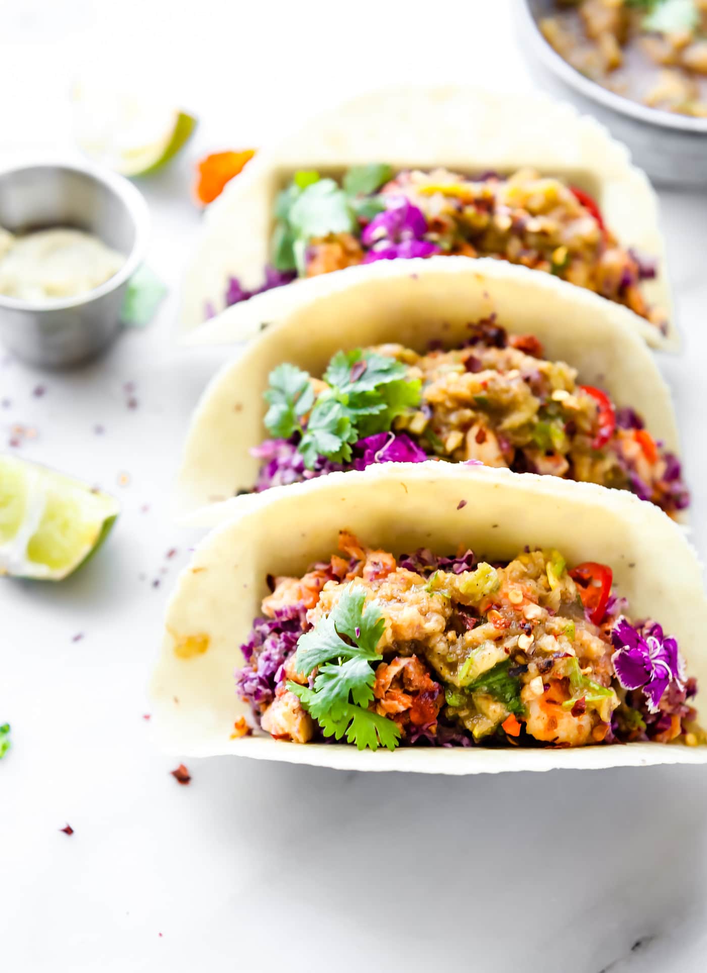 Pickled Pineapple Baja Fish Tacos are my latest love! Easy to make with homemade pickled pineapple relish, cabbage slaw with avocado cream, and Baja style fried fish all wrapped in a warm gluten free tortilla! So much flavor but also SO simple and healthy to make.