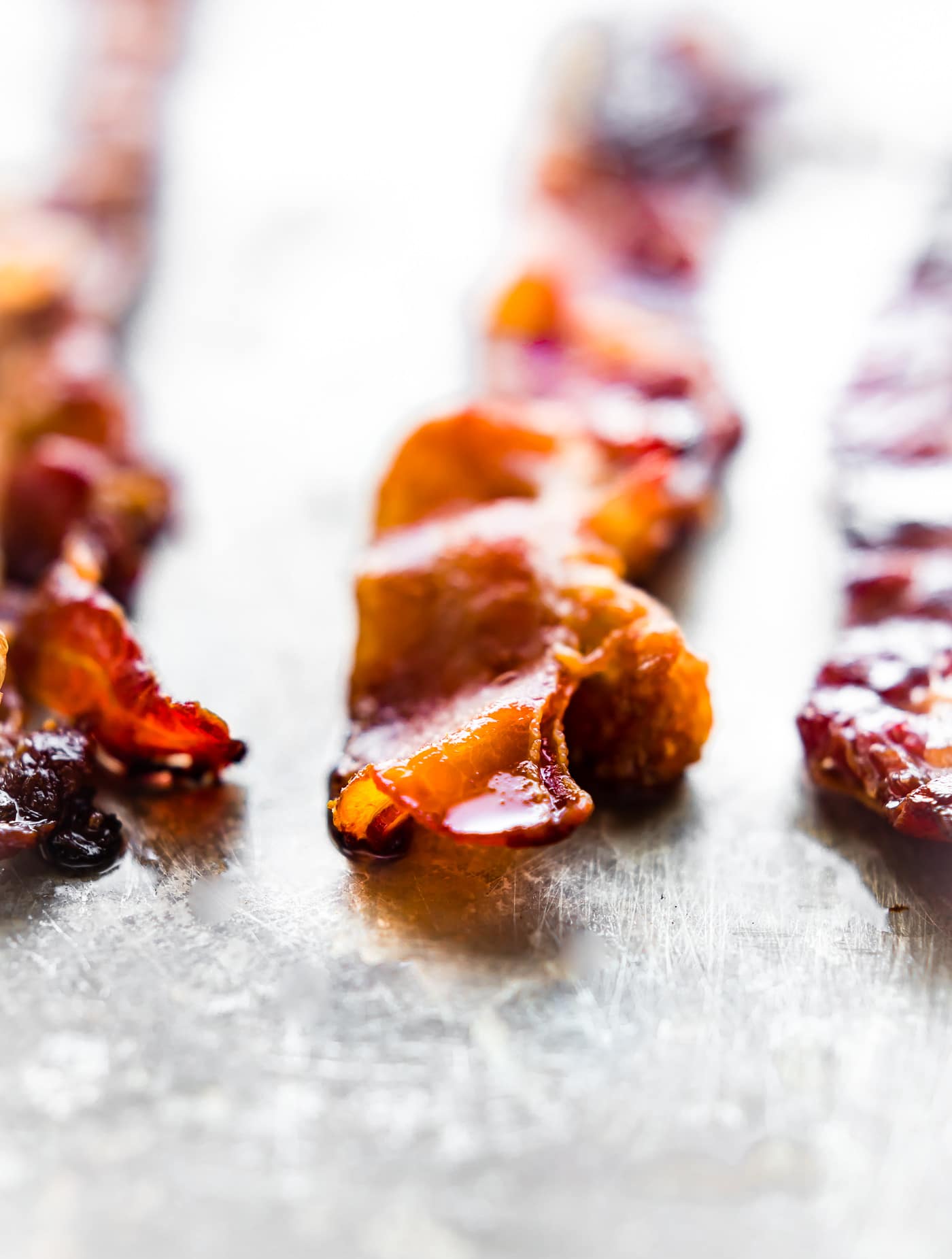 Macro view crispy bacon on baking sheet