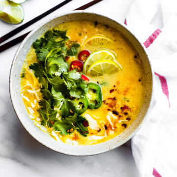 Overhead view Thai coconut cabbage soup in stone bowl.