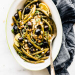 dish of balsamic braised green beans with olives.