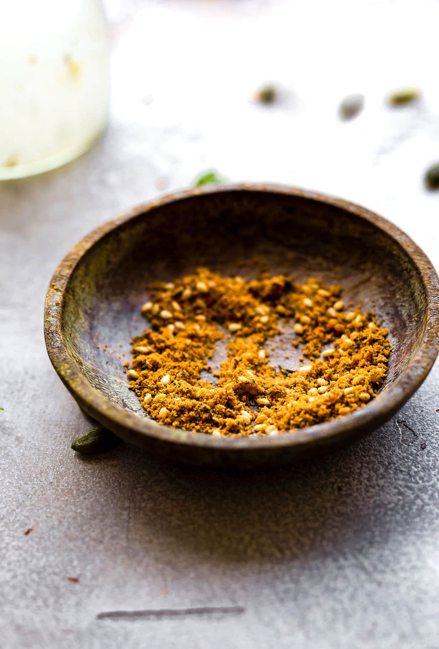 Dukkah spice in small wooden bowl