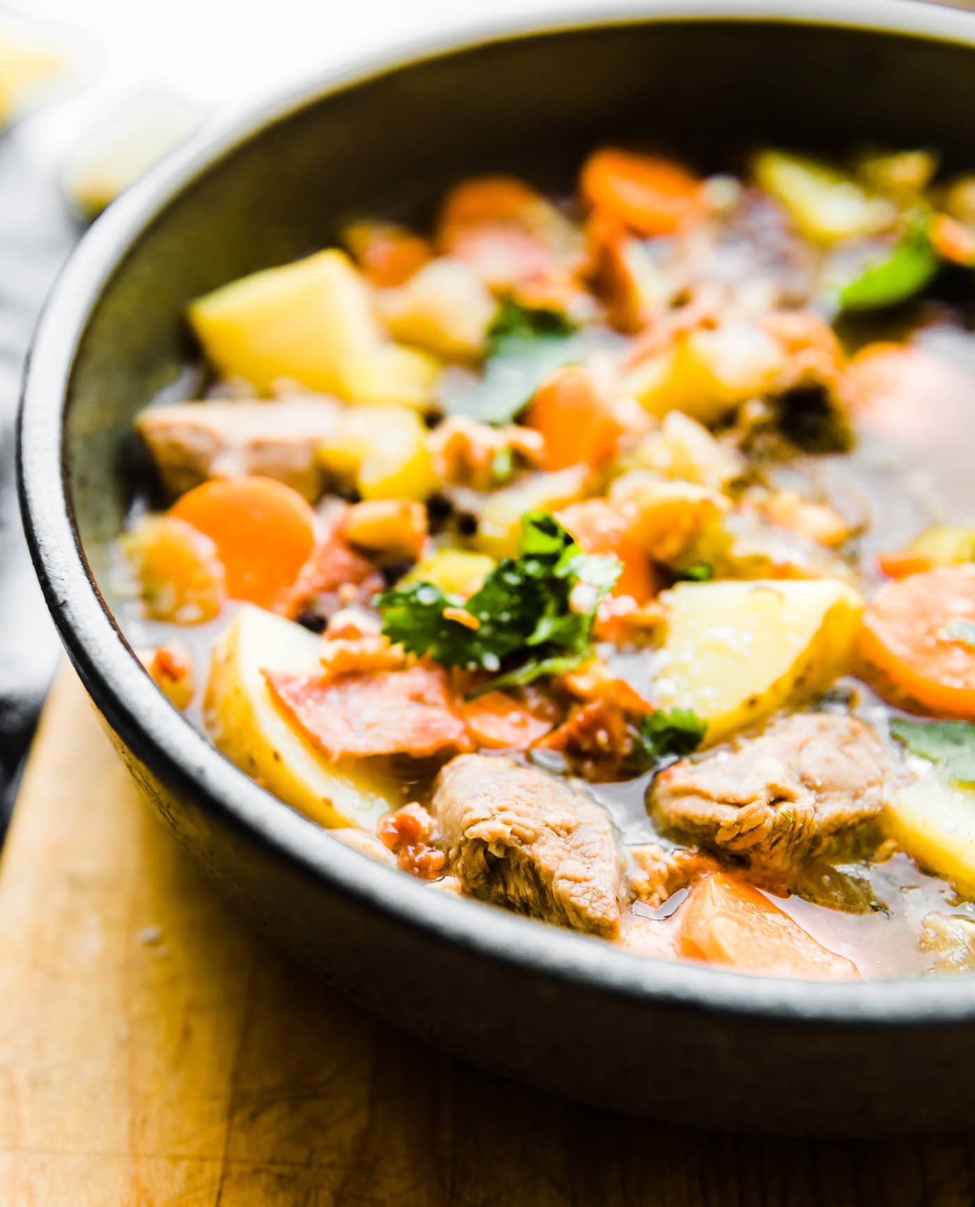 One pot Bacon Braised Lamb Stew! This paleo friendly Lamb stew is PACKED full of vegetables and flavor! Minimal ingredients and easy to make. Let's just say the bacon and lamb combo together do wonders. Great for family dinners, freezer friendly, and whole 30 option. #stew #paleo #onepot #whole30