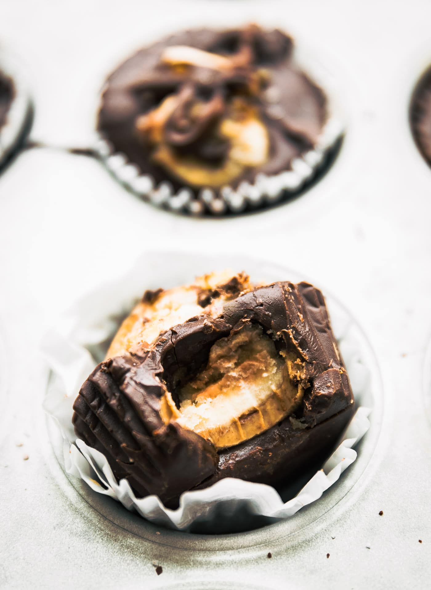 EASY Dark chocolate almond butter cups with caramelized bananas in the middle and sliced on top. .