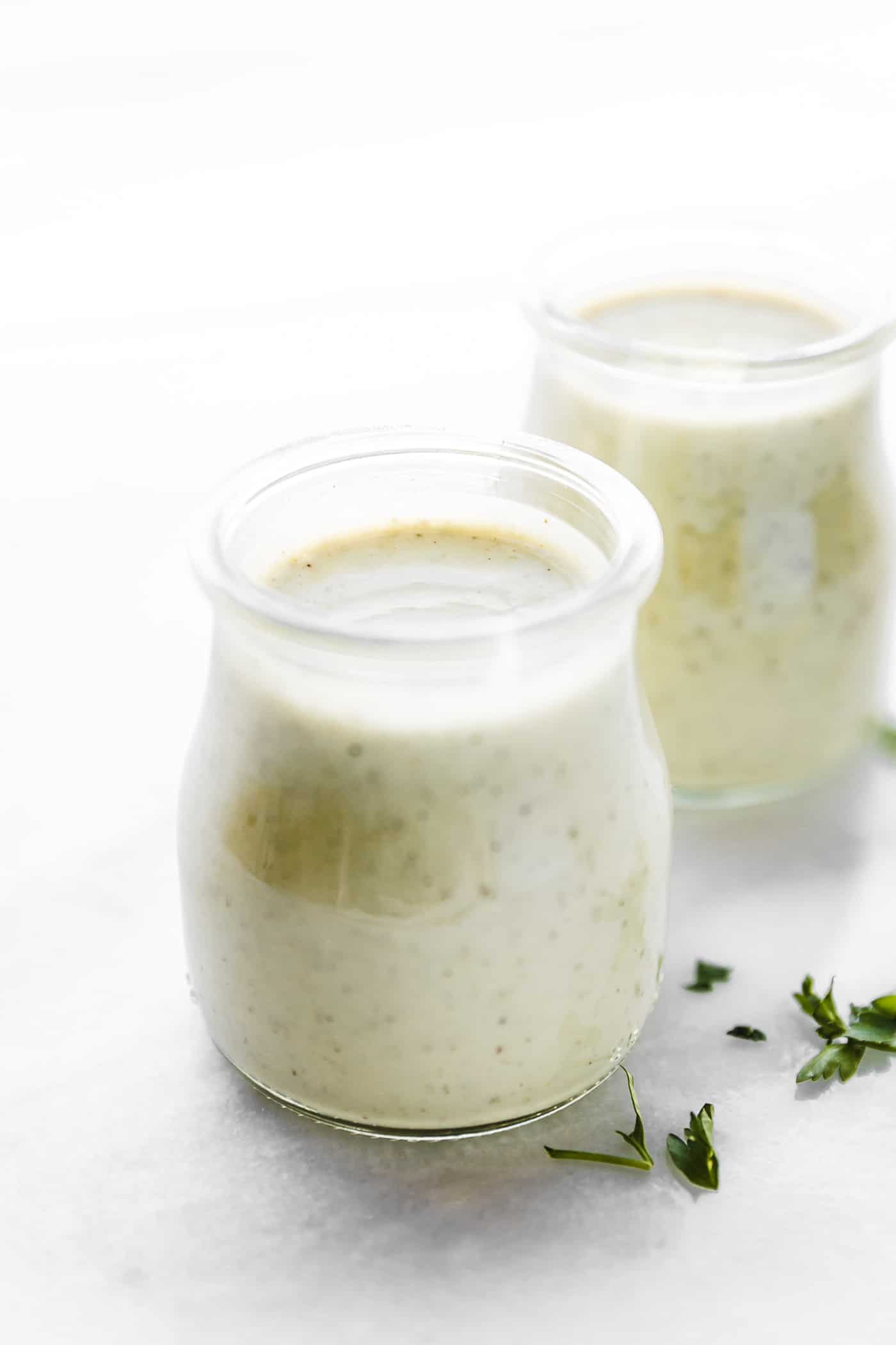 Quick Homemade Vegan ranch dressing (aka "Rancher's Dressing") is a tasty dressing that can be slathered on salad, served as a veggie dip, or dunked in your favorite spicy foods. Vegan, paleo, and Whole 30 friendly, this creamy dairy-free ranch dressing is made from blended cashews, nut milk, herbs, and oil. We're serving it up in a veggie packed snack platter that's perfect for any occasion. #vegan #paleo #ranch