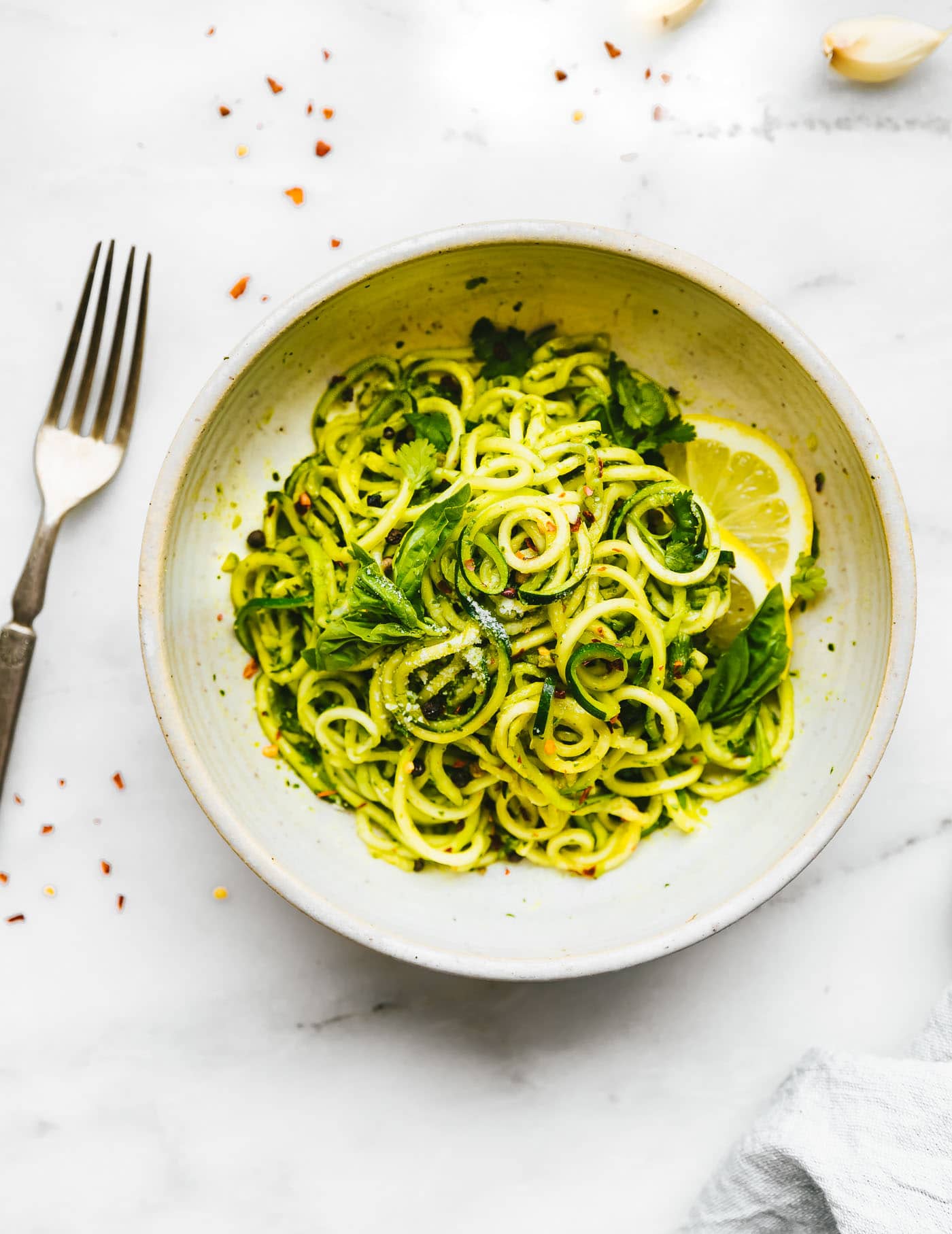 vegetarian dinner of zucchini noodle pasta with spicy pesto sauce