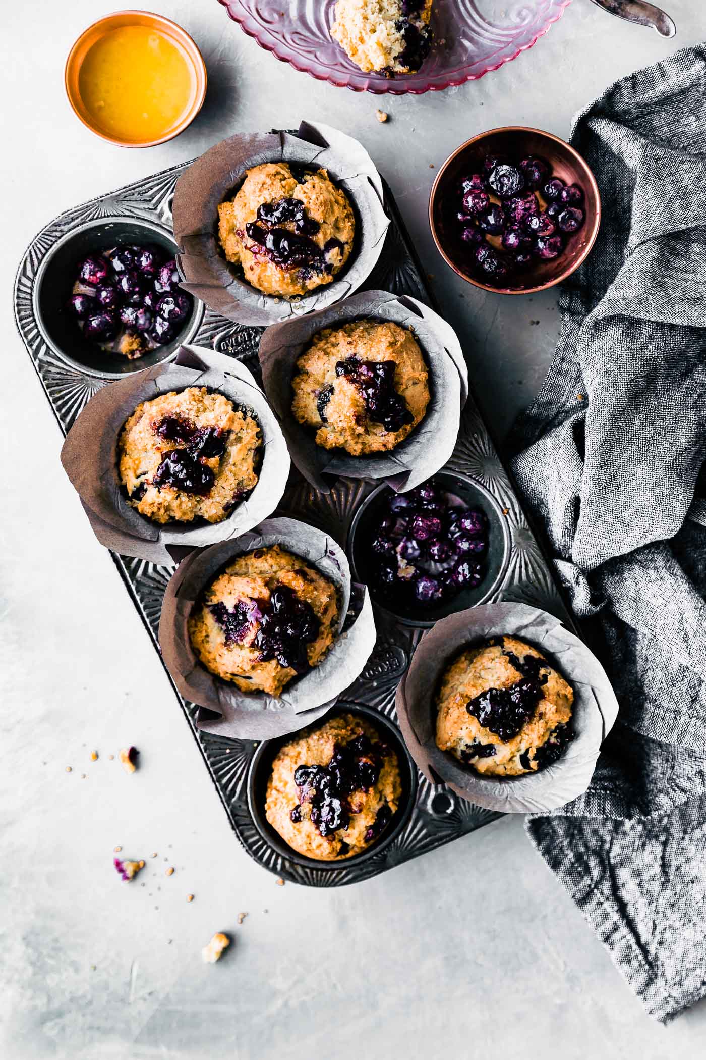 muffin tin filled with gluten free blueberry muffins