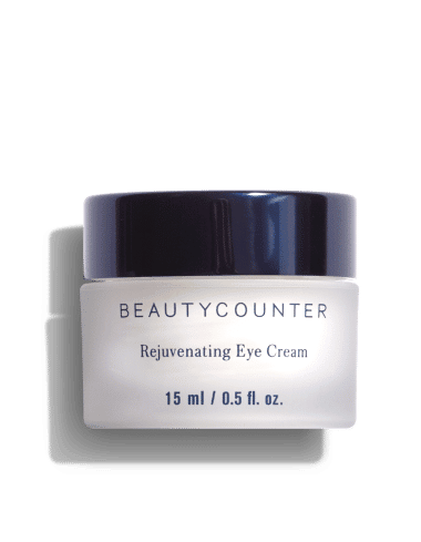 White jar of BeautyCounter rejuvenating eye cream with black lid.