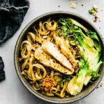 Overhead view Asian Pesto Chicken Noodle Stir Fry in stone bowl
