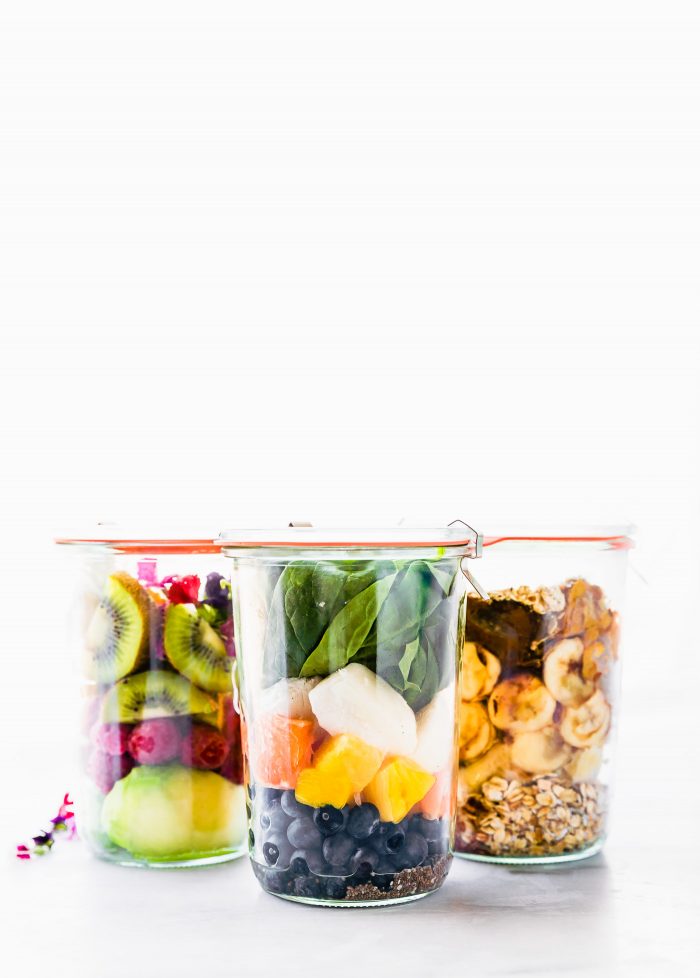 Three glass jars filled with collagen protein smoothie packs
