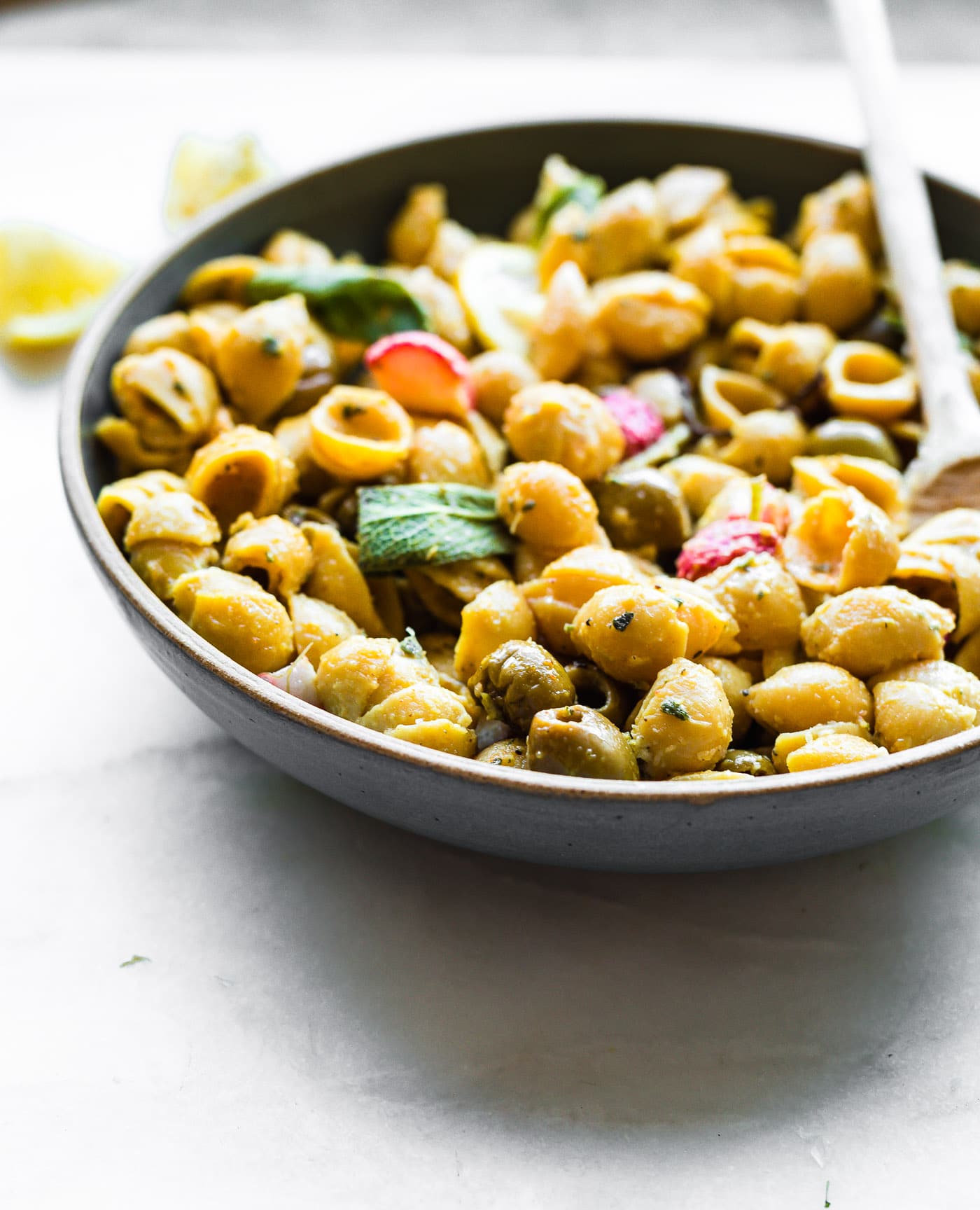 Roasted Radish Lemon Chickpea Pasta with olives! This vegan chickpea pasta recipe is packed with lemony flavor, making it the perfect light, gluten free pasta dinner for summer! #dinner #vegan #pasta #cleaneating #healthy #dairyfree #healthyrecipes