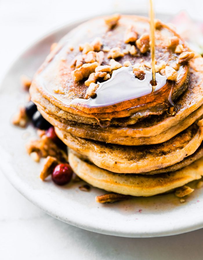 stack of grain free coconut flour pancakes with syrup