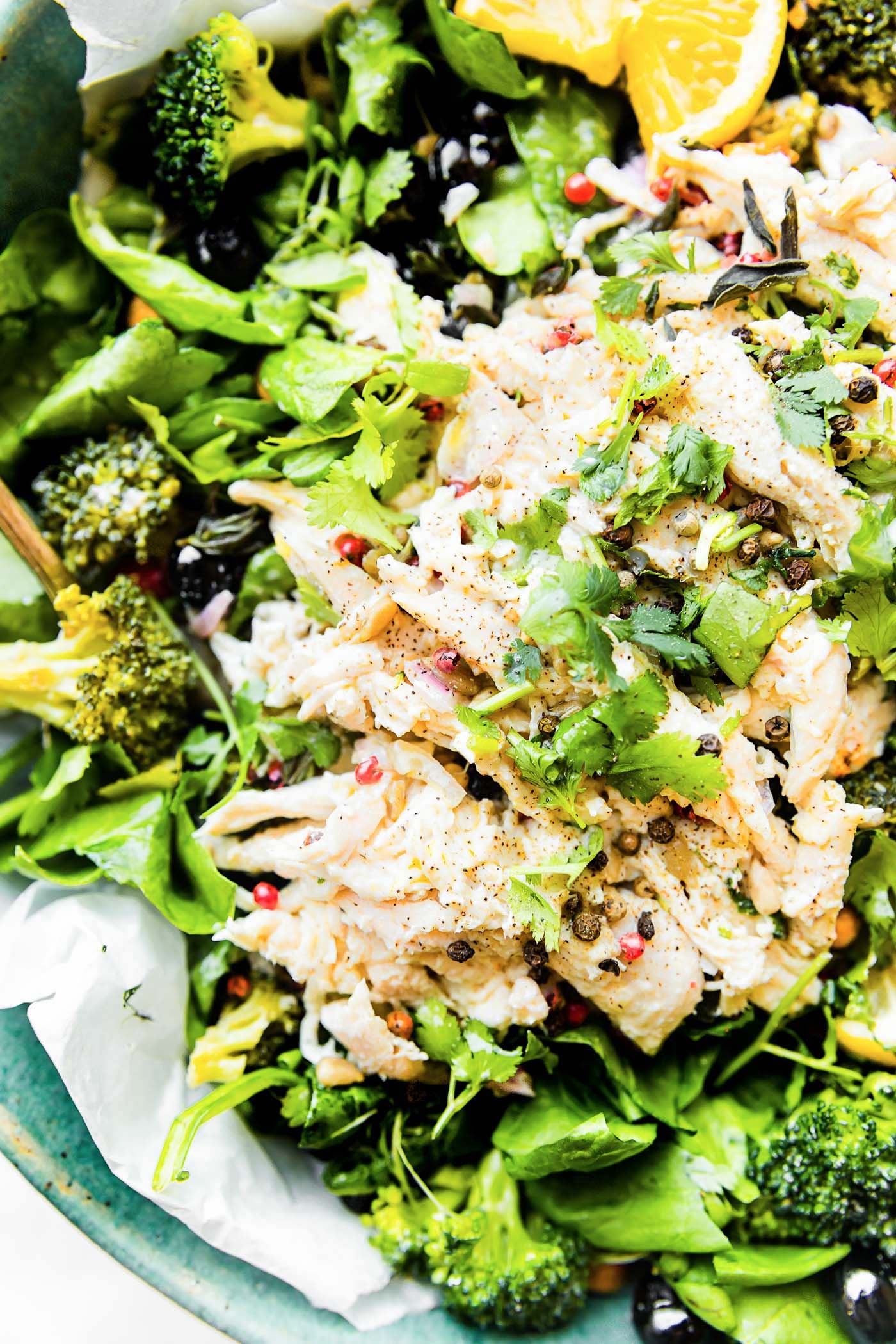 A lightened up Mayo Free Chicken Salad! A chicken salad bowl that's perfect for a healthy meal or side dish. Spinach, roasted broccoli, berries, chickpeas, roasted chicken, and herbs tossed in a light yogurt olive oil dressing.