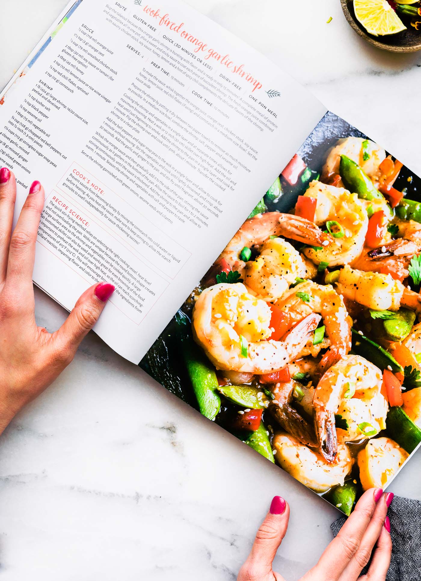 Open cookbook to a Wok-Fired Orange Garlic Shrimp recipe with photo