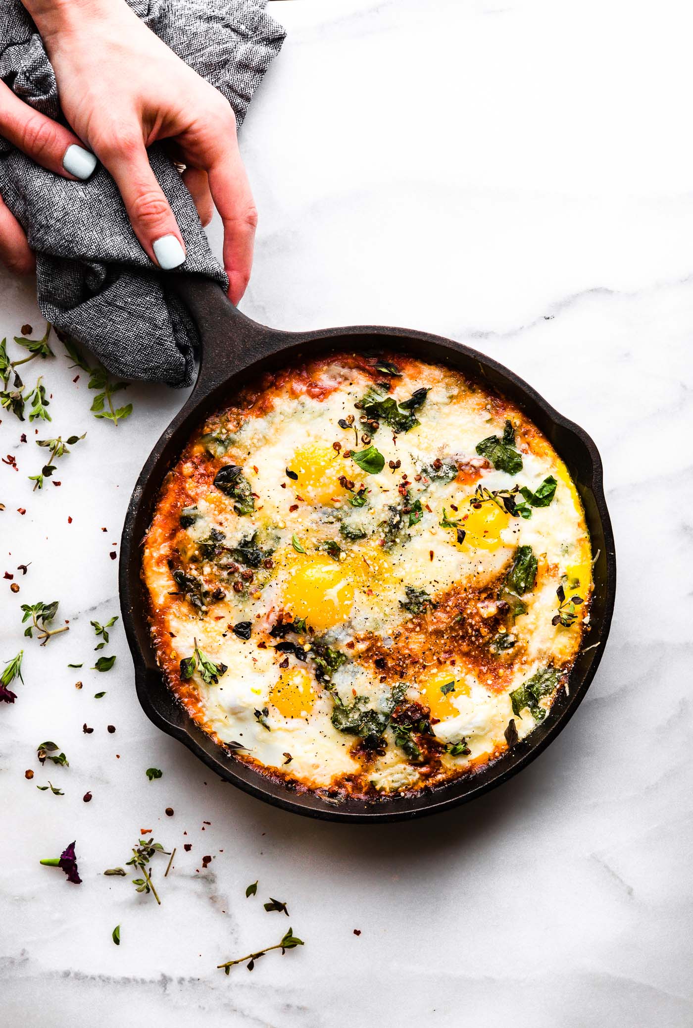 Overhead view small cast iron skillet with baked frittata