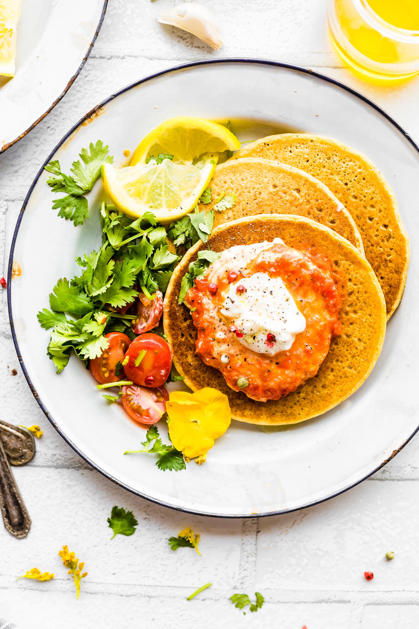 Weekday pancakes suitable for dinner? Sure, why not! These Chickpea Pancakes with Harissa Yogurt Sauce are wholesome and quick to make. A Chickpea flour pancake (Similar to Socca) with a thick and creamy spicy Yogurt topping. Vegetarian, grain free, rich in protein and calcium! 